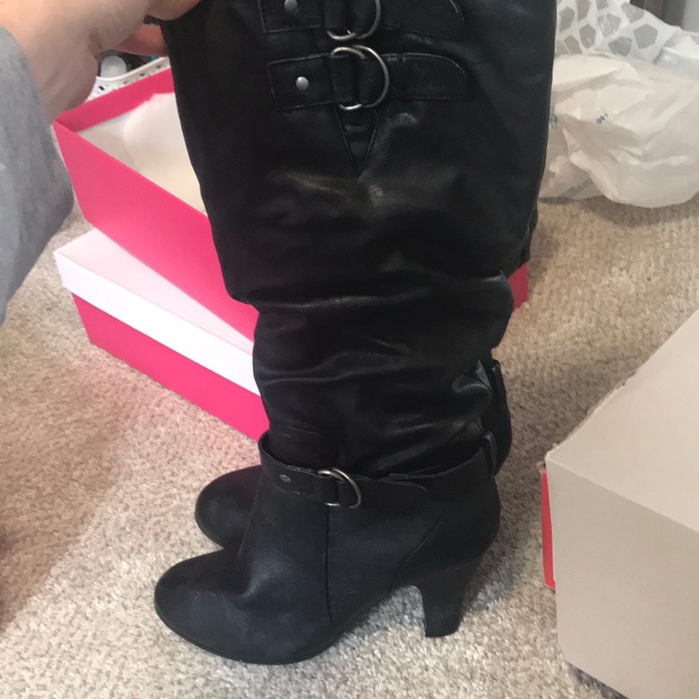 Black heeled knee high boots
